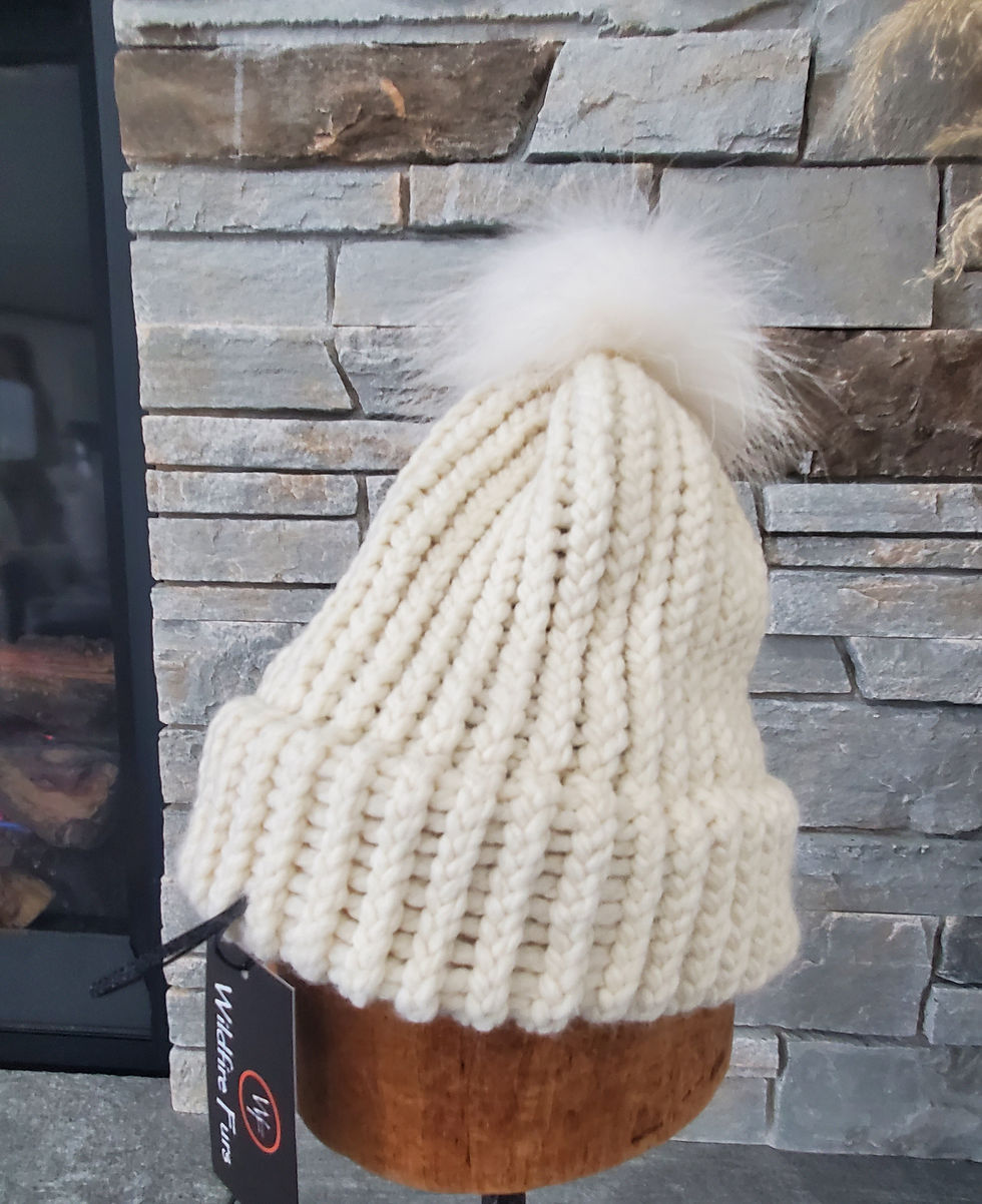 White knit hat with fur pom