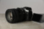 modern-photo-camera-grey-table-photographer39s-equipment-min.jpg