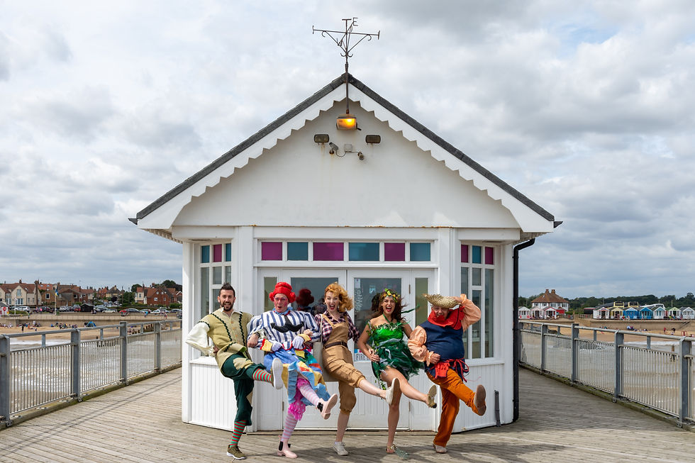 Group of people in costume chorus-dancing outside
