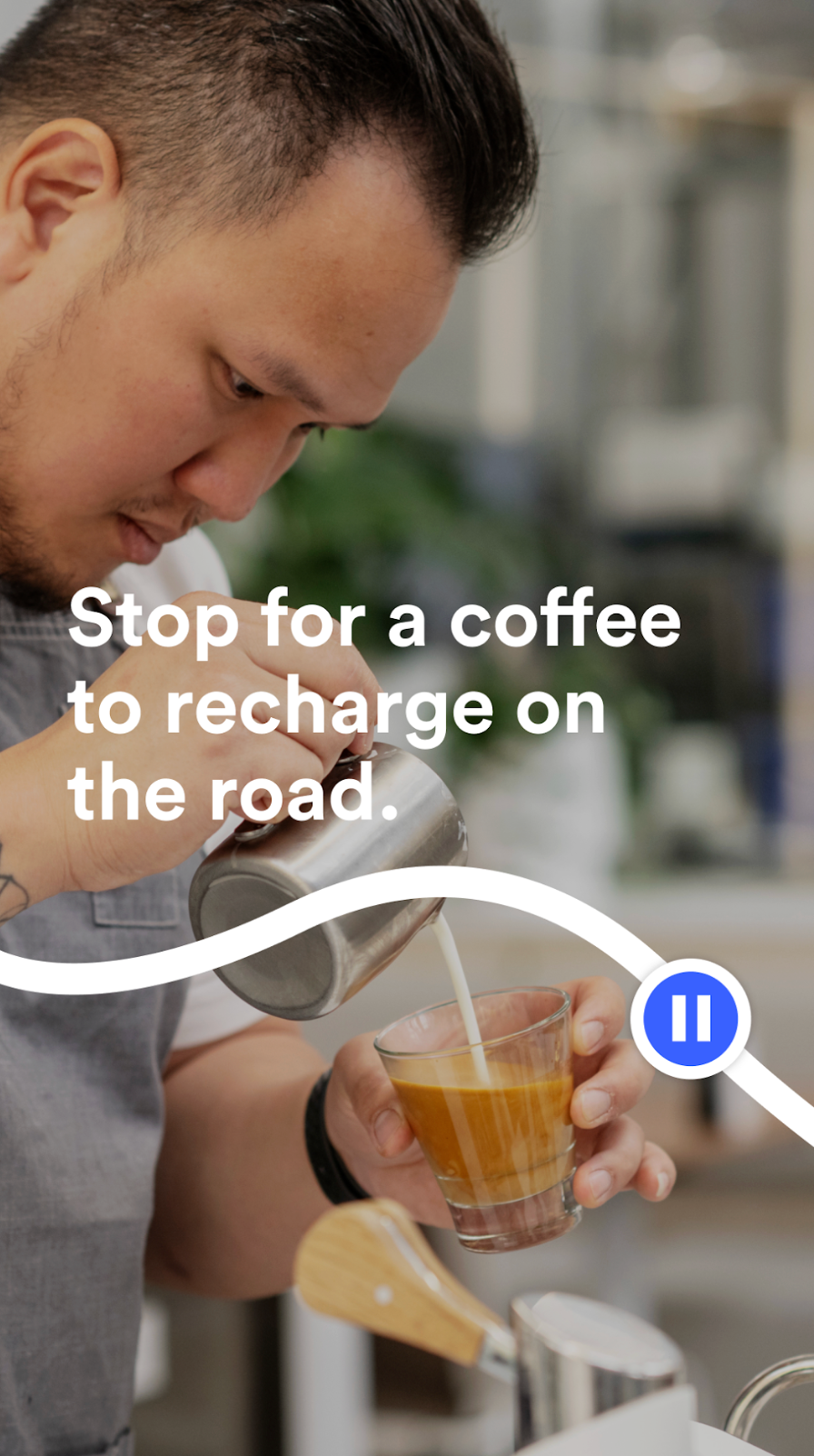 Stop for a coffee to recharge on the road. A barista pours milk.