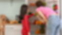 mother daughter getting food from repaired fridge.png