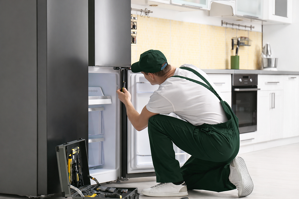 technician repairing a fridge