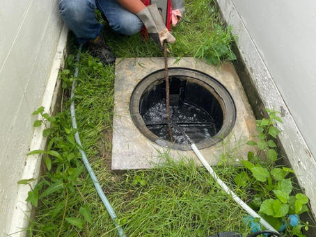 Grease trap pump-out service removing wastewater from residential system