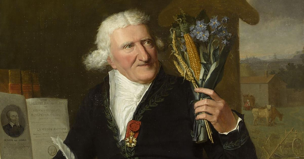 Elderly man - Antoine-Augustin Parmentier - in formal attire holds flowers and corn, background shows a rural scene with cows. Books and papers visible, calm expression.