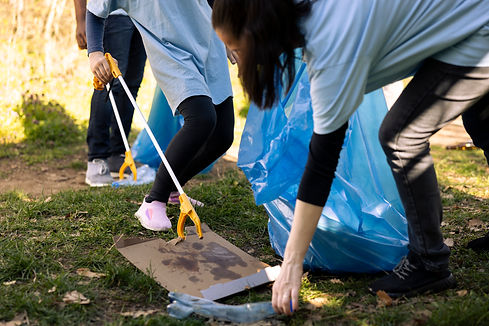child-woman-grabbing-junk-plastic-from-ground.jpg