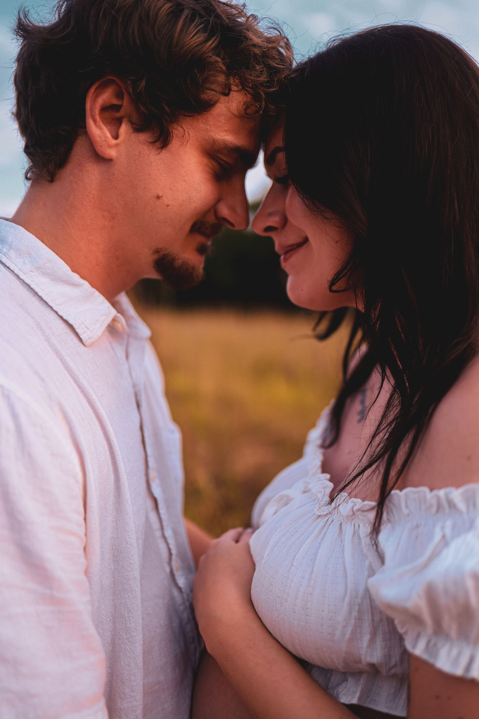 Wichita maternity photo couple touching foreheads