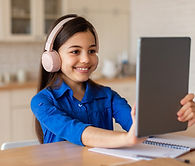 schooler-girl-wearing-wireless-headphones-sitting-2025-03-18-16-21-21-utc.jpg