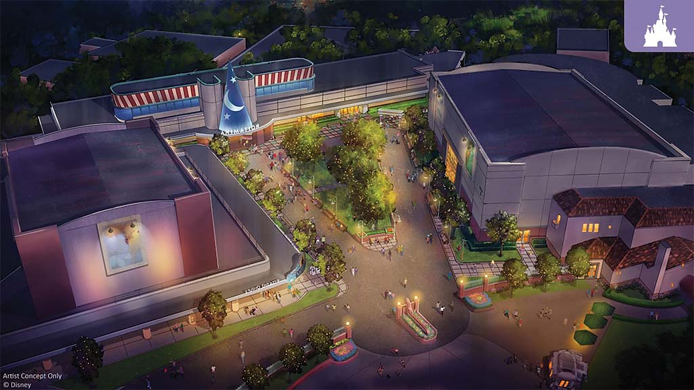 Aerial view of an animated-themed park at night with glowing lights, buildings featuring colorful murals, and trees lining pathways.