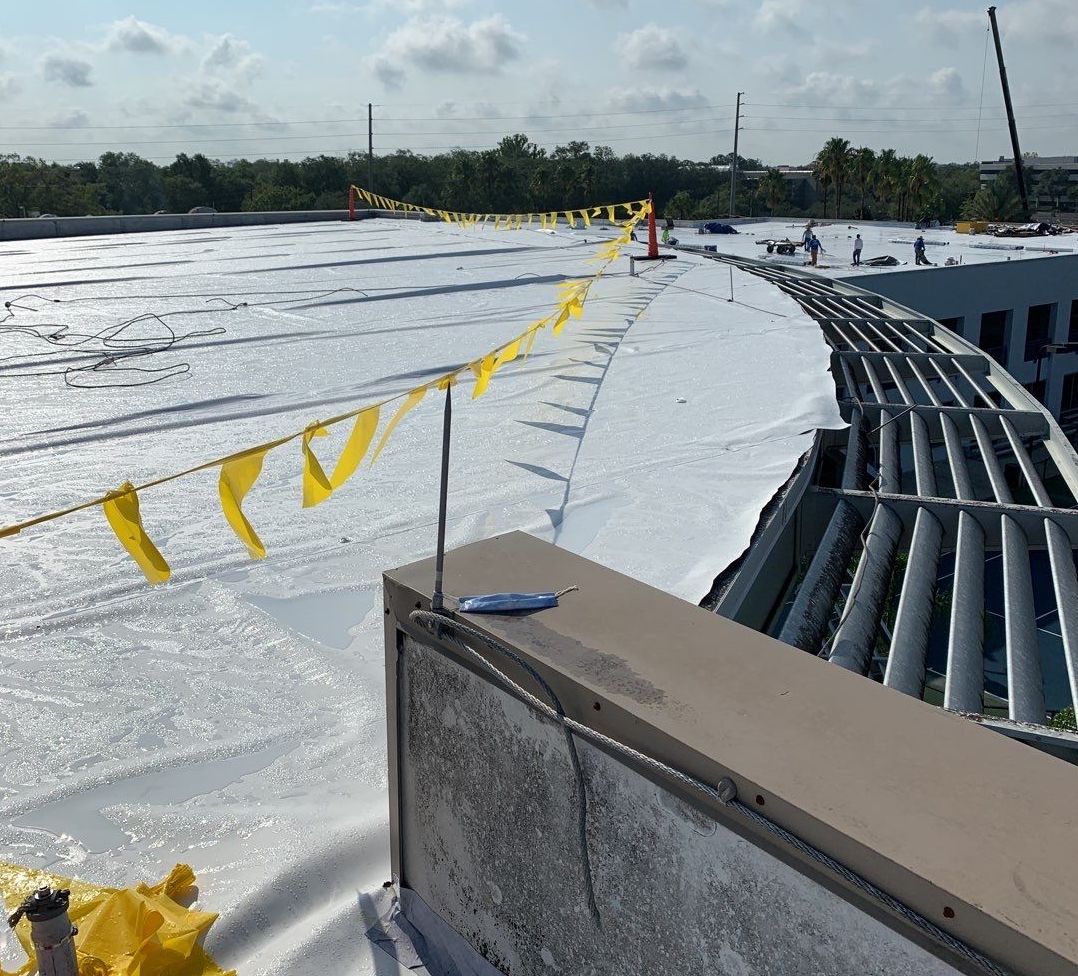 Commercial building with roof damage after a severe storm, illustrating the challenges discussed in our blog on handling storm-related roof damage in commercial properties.