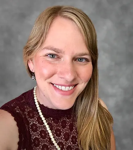Professional headshot of Ashley Devore, Success Coach.