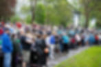 Participants listen to Walk speakers in the rain