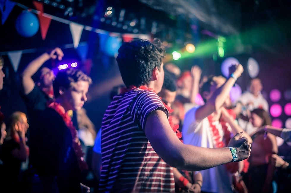 Partygoers enjoy the vibrant atmosphere on the dance floor at Disco Londoner in Lloret.
