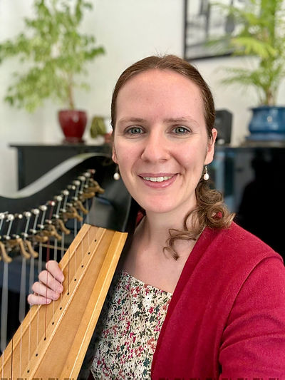 Tegan Noiseux with a lever harp at the Mount Pleasant studio