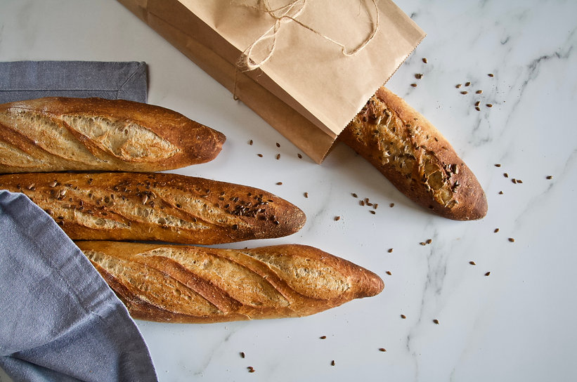 The Loaf Tin's famous French Baguettes - here are our standard white and seeded wholemeal variety.