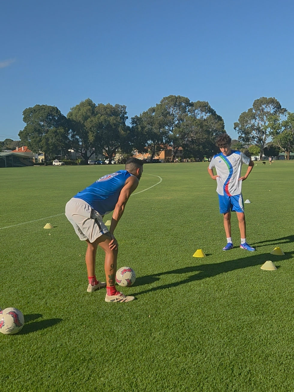 football coach and player in a 1-on-1 training session