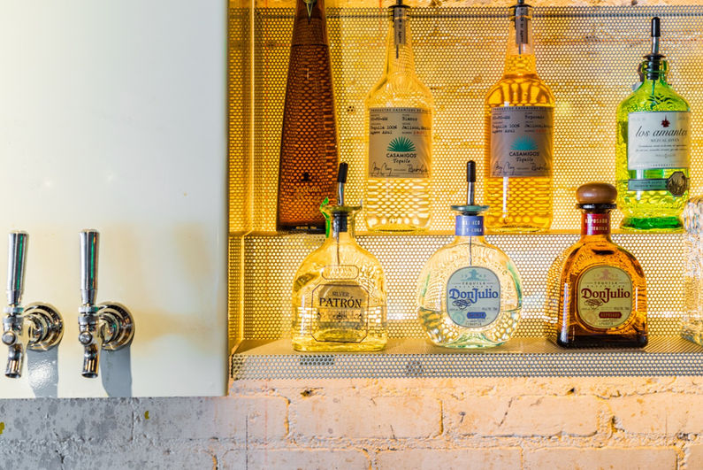 liquor display with glass and brick