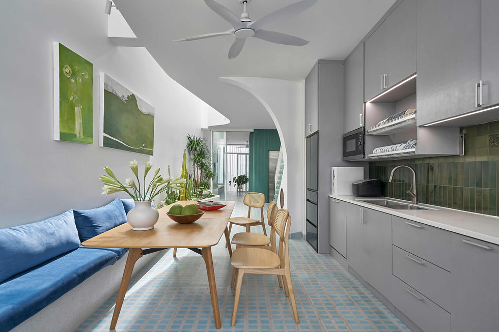 A contemporary townhouse nestled in the heart of Chợ Lớn, TA House reinterprets Saigon’s urban vernacular through a modern lens. Defined by its central skylight, green courtyard, and custom-crafted details, the design creates a bright, airy living environment while respecting the area’s mixed-use heritage. A façade of concrete slats and lush balconies frames a home where light, ventilation, and layered spatial connections converge.