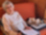 Complimentary Screening Call with Dr Susan Peden at Animal Health Answers - helping a woman with her dog on a couch