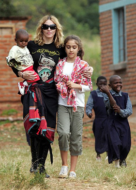 Madonna wearing a black kikoi sarong in Malawi