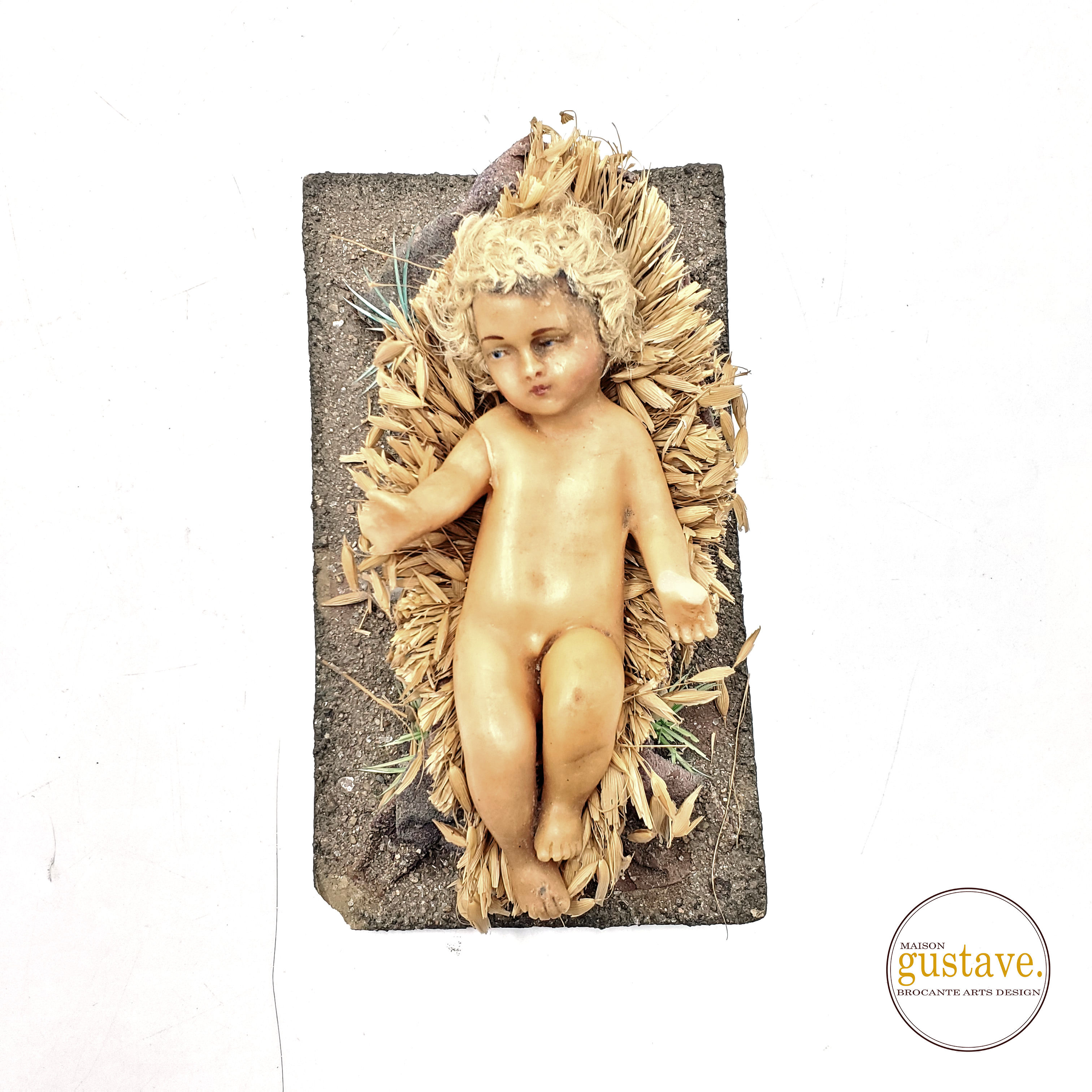 Enfant Jésus de cire ancien sur lit de paille