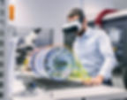 Engineer using a VR headset with a digital visualisation of a jet engine – digitalization and AI in aviation