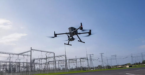 Industrial drone performing power line and utility infrastructure inspection in the UAE.