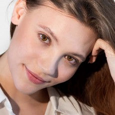 Thumbnail: Adore Bi-Honey colored contact lenses —on model eyes