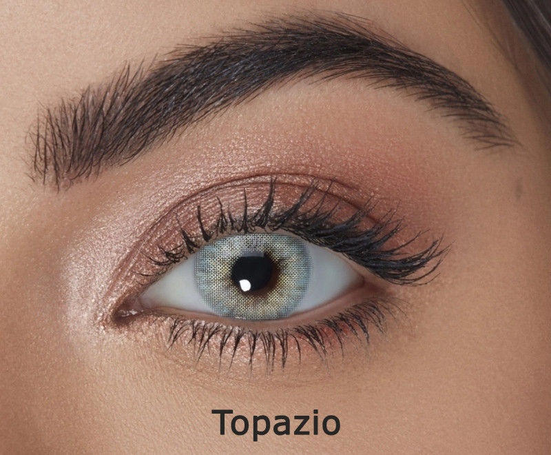 Solotica Hidrocor Topazio yearly blue-green colored contact lenses on eye