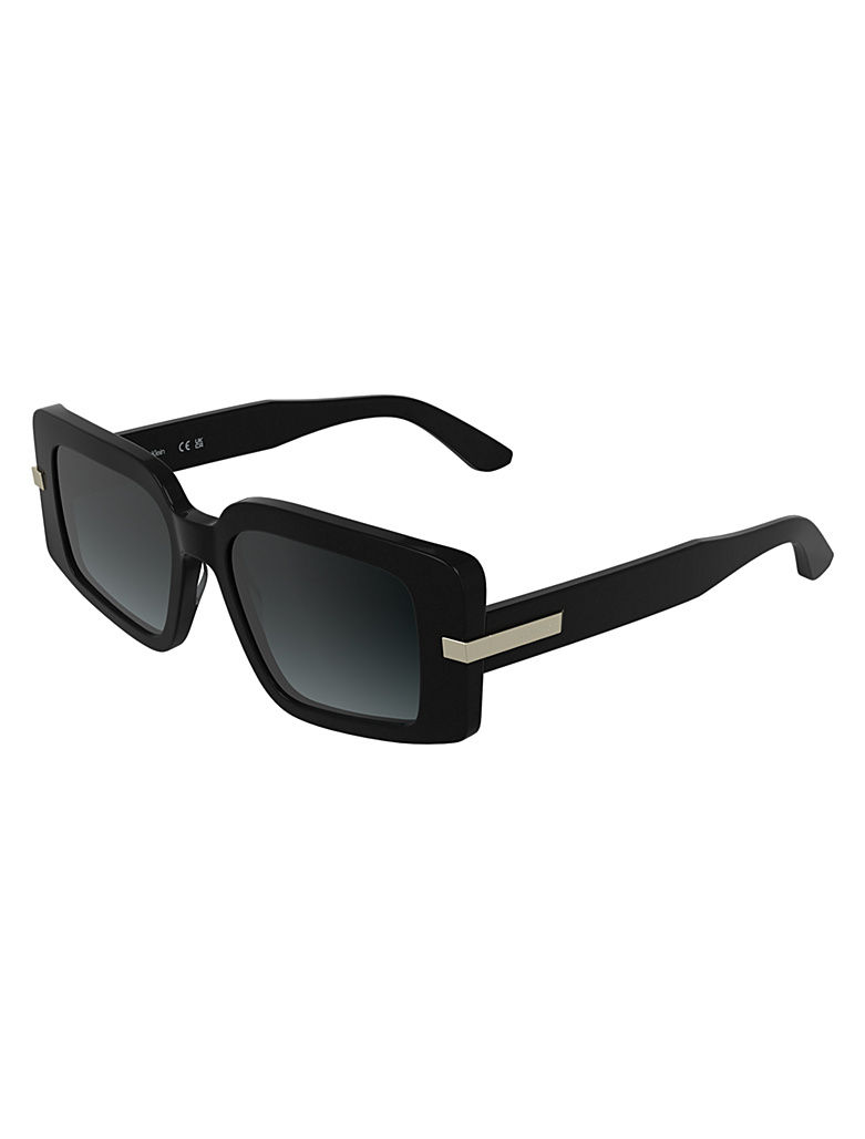 side view Calvin Klein CK2553S 001 oversized square black sunglasses with dark grey gradient lenses