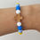 Thumbnail: Children's Sky Blue, Blue & Yellow Silicone Bead Catholic Cross Bracelet