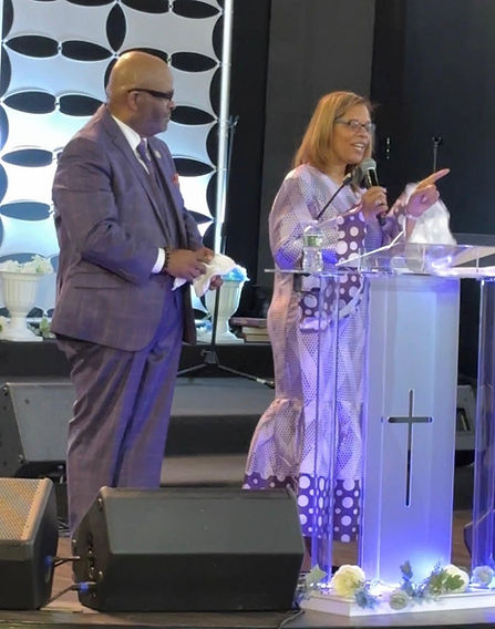 Pastor Rev. Reginald W. Atkins and First Lady Dr. Cynthia Atkins serving together during worship