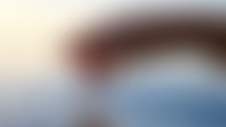 Hand touching calm water