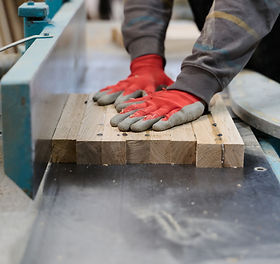 2400-close-up-of-worker-carefully-cutting-and-planing-wooden-pieces-for-furniture-in-wood-