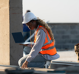 2400-young-female-architect-working-on-a-construction-site-with-a-laptop-in-her-hands.jpg