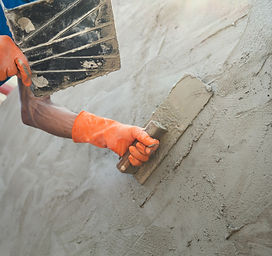 2400-closeup-hand-of-worker-plastering-cement-at-wall-for-building-house(1).jpg
