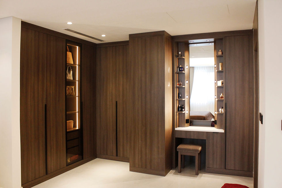 Brown wood-finish bedroom wardrobe with a dressing table and black tinted glass display cabinets with sensor lighting