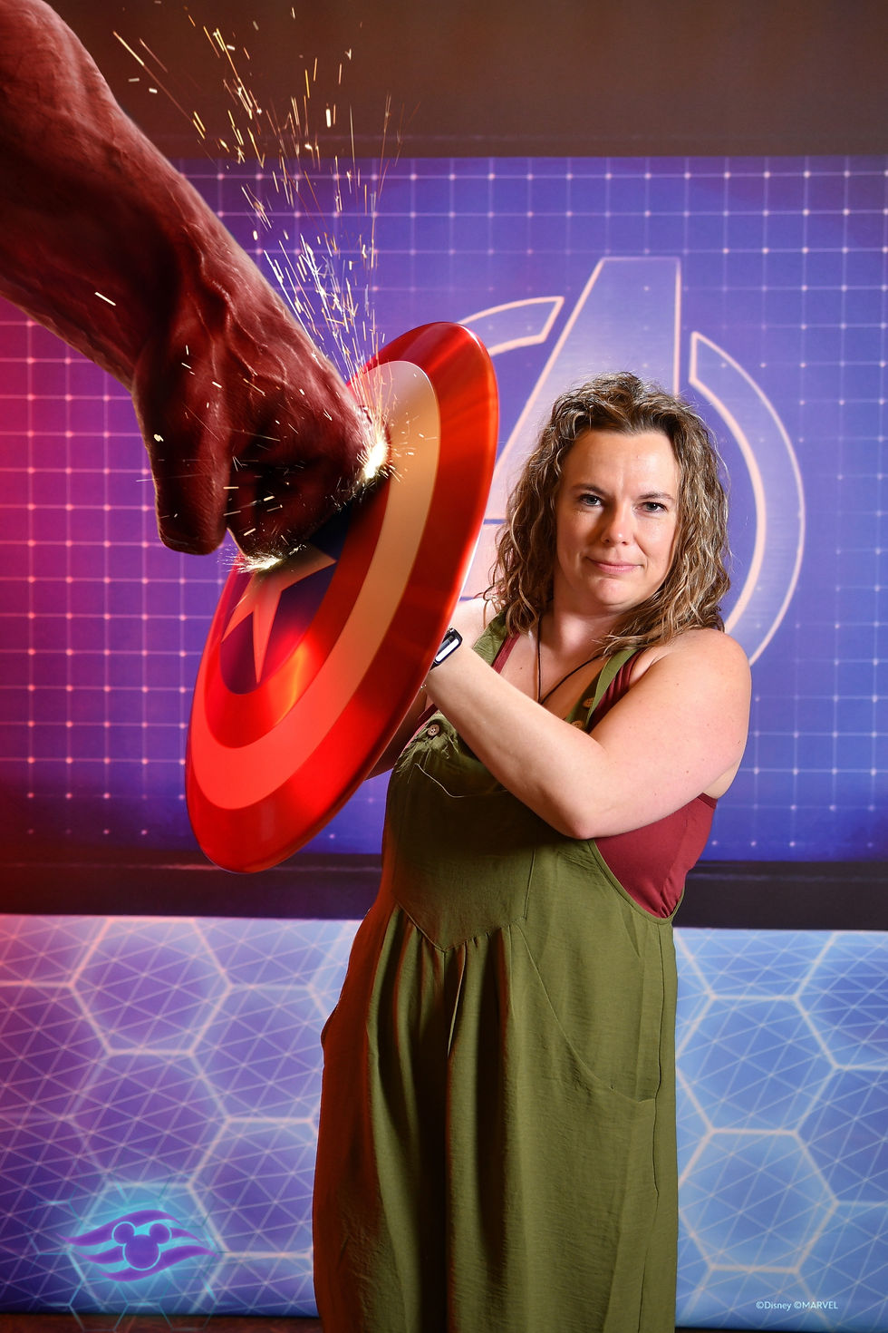 A person holding Captain America's shield, with Thanos punching the shield