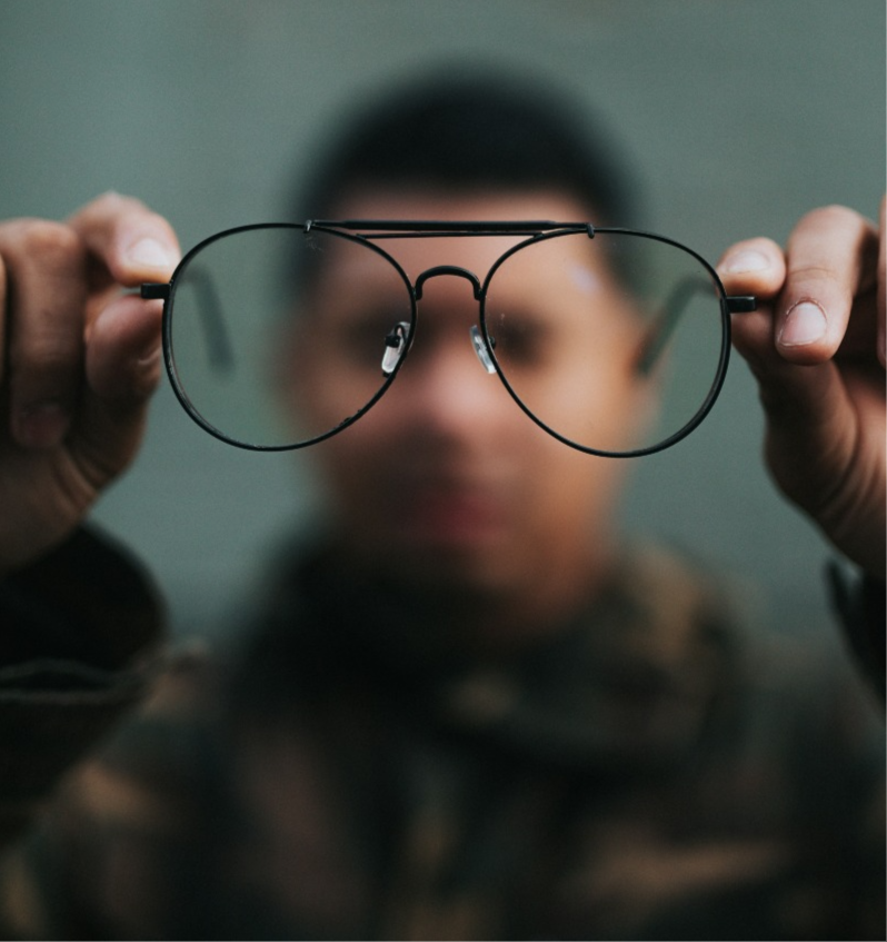 Man holding glases infront of him