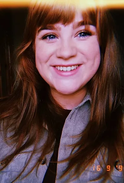 Doireann Kelly, in a sepia-style headshot.