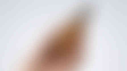 eremos serum bottle packaging in a hand