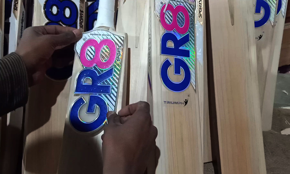 ‘GR8’ stickers pasted on cricket bats.