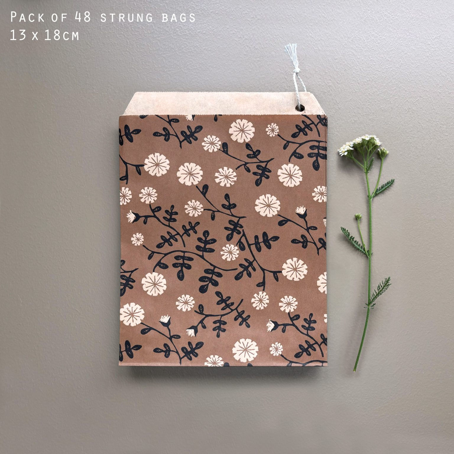 East of India Paper Bags (x48), daisy design on hanging string, approx 15 x 20cm