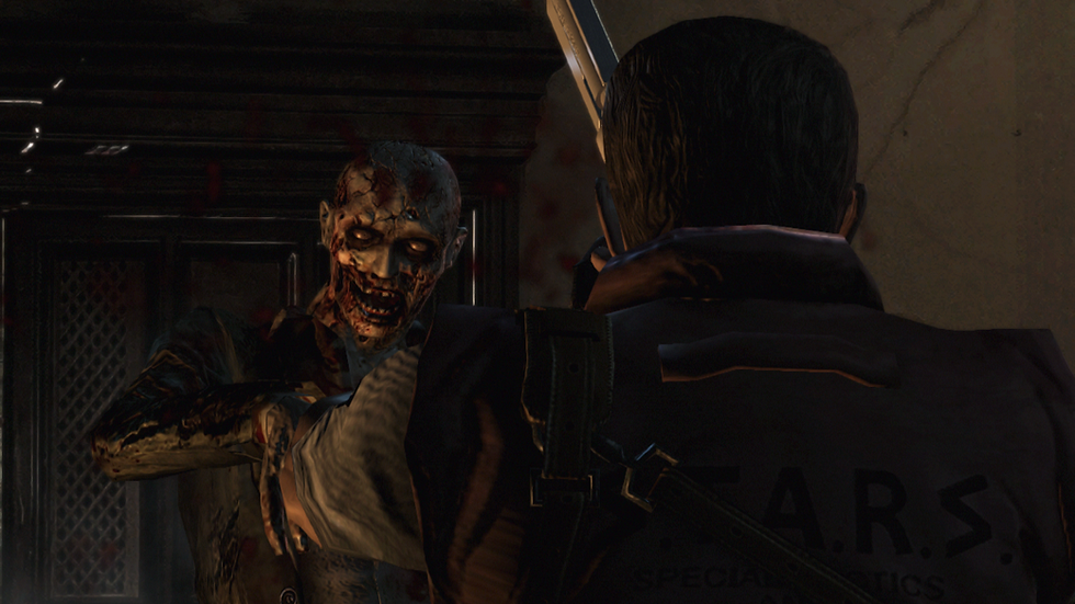 Gamplay screenshot of Resident Evil. The camera is positioned over Wesker's left shoulder as he is face to face with a zombie.