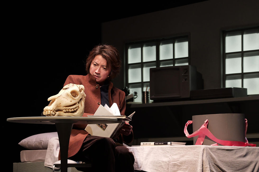 Character staring at animal skull
