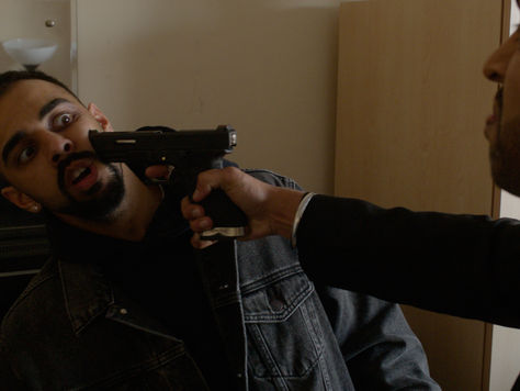Ravi with a gun pointed to his face by Guj
