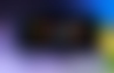 A Nintendo Switch 2 home screen showing Cyberpunk, Red Dead Redemption, Batman Arkham Asylum, and Doom icons. A grey SNES controller is in the foreground and a Mario ? block is on the right, both are blurry.