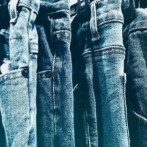 A collection of Denim jeans displayed on a rack
