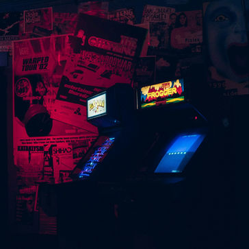 a retro arcade lit up with blue and red lights