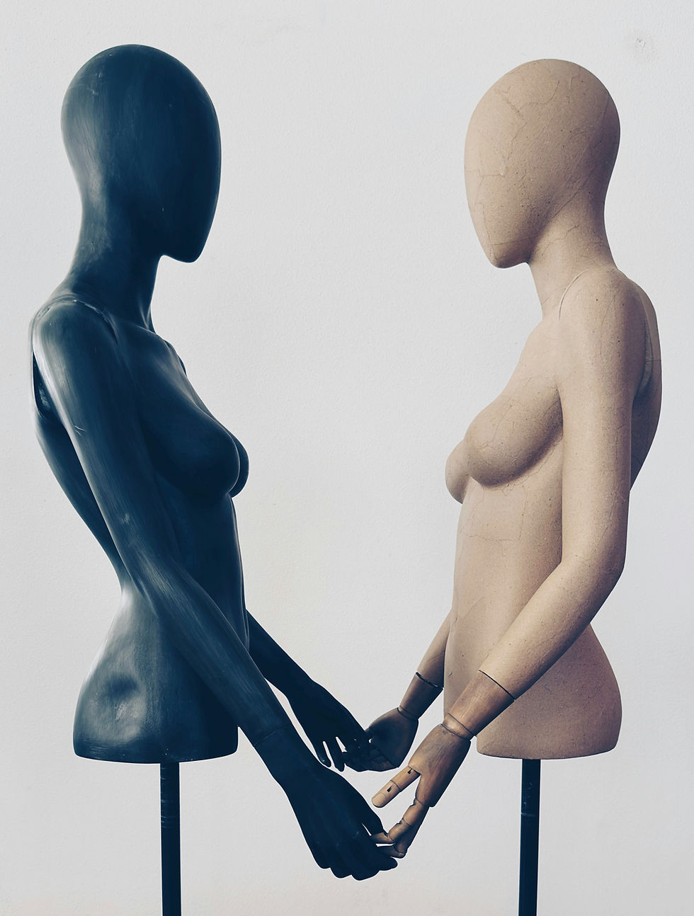 2 mannequins holding hands