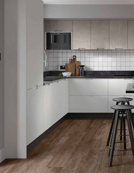 Modern white kitchen with wood floor and black stools